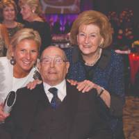 Cheri and Helen DeVos posing next to Richard DeVos.